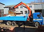 Бортовой автомобиль КАМАЗ-65117 оснащенный гидравлическим КМУ Palfinger PK 23500А
